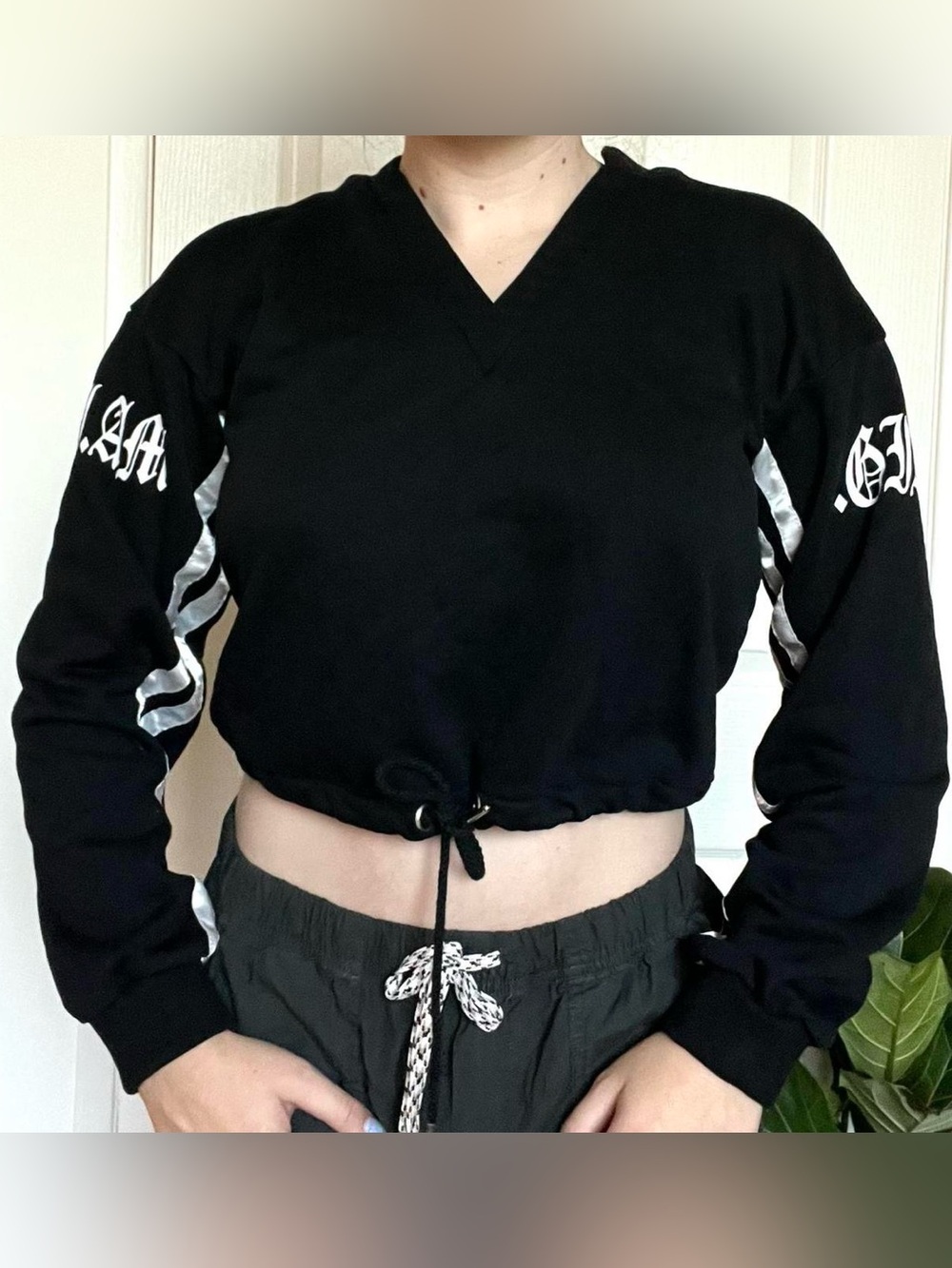 I.AM.GIA Black Cropped V-Neck Drawstring Sweatshirt with White Sleeve Accents